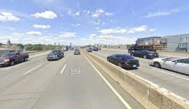 Crushed Car Chaos: Tractor-Trailer Overturns, Halts Traffic on I-93, Two Injured