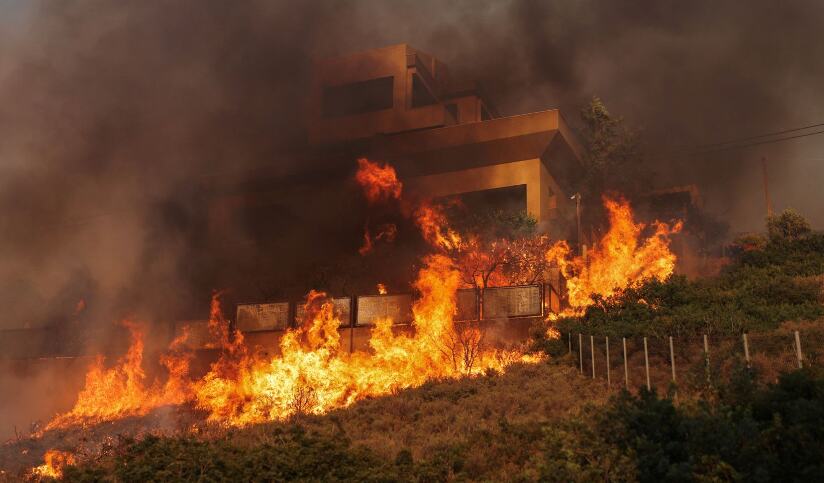 Devastating Wildfires Sweep Through Greece, Forcing Villagers to Flee Homes Amidst Fierce Winds