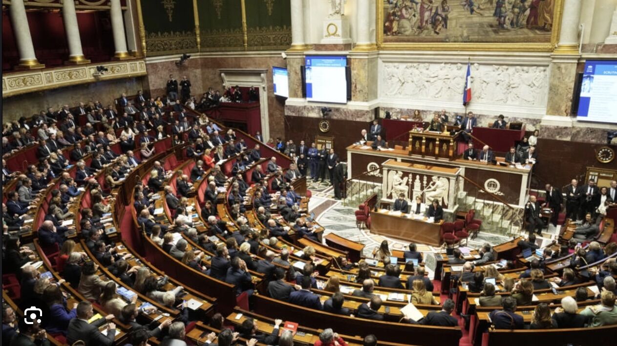 French lawmakers agree on controversial immigration bill, sparking praise and backlash