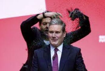 Labour Party Leader Keir Starmer Interrupted by Protester in Glittering Display of Democracy Demands