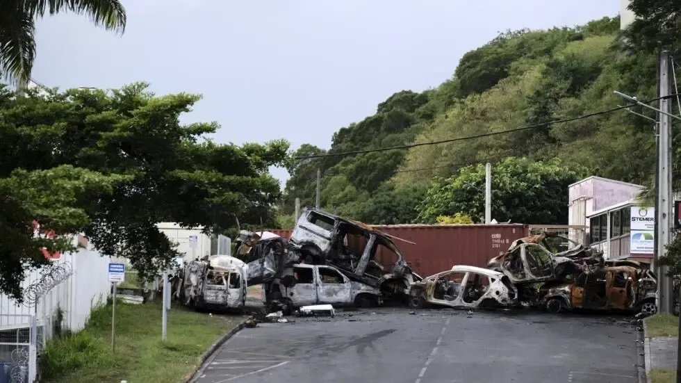 Macron Halts New Caledonia Voting Reform Amid Unrest
