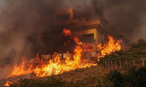 Devastating Wildfires Sweep Through Greece, Forcing Villagers to Flee Homes Amidst Fierce Winds