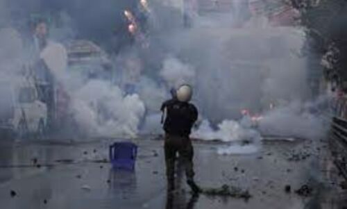 Tear gas fired as Pakistani police clash with Imran Khan supporters ahead of the election