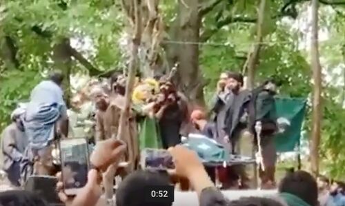 AK 47 salute by mother of slain HM militant AK 47 salute by mother of slain HM militant