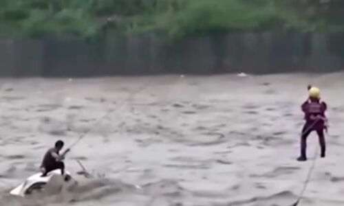 Typhoon Doksuri : Miraculous Rescue Caught on Video man Trapped in Swollen River Saved from Certain Disaster Typhoon Doksuri : Miraculous Rescue Caught on Video man Trapped in Swollen River Saved from Certain Disaster