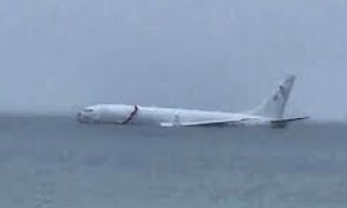 Navy Plane Overshoots Runway, Plunges into Kaneohe Bay - Miraculous Escape for All 9 Onboard! Navy Plane Overshoots Runway, Plunges into Kaneohe Bay - Miraculous Escape for All 9 Onboard!